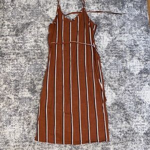 Gently used, spaghetti strap, rust striped midi-dress with waist tie